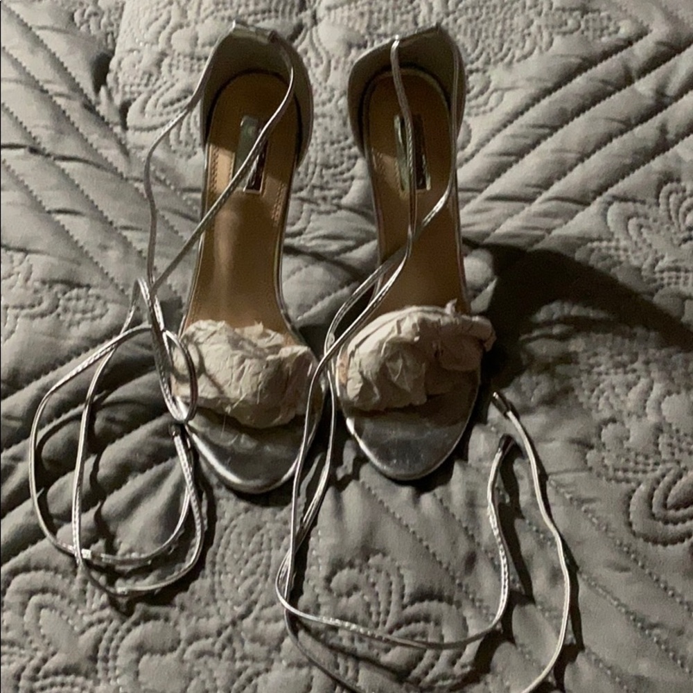 Silver Heels w clear strap and silver wraps.